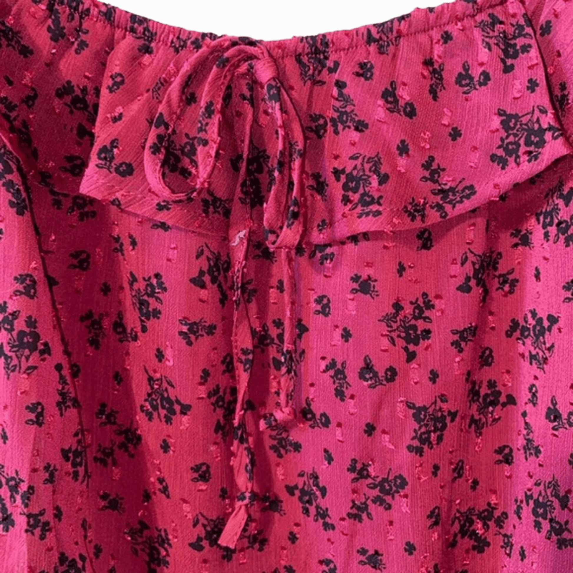 Pink fabric with black floral pattern