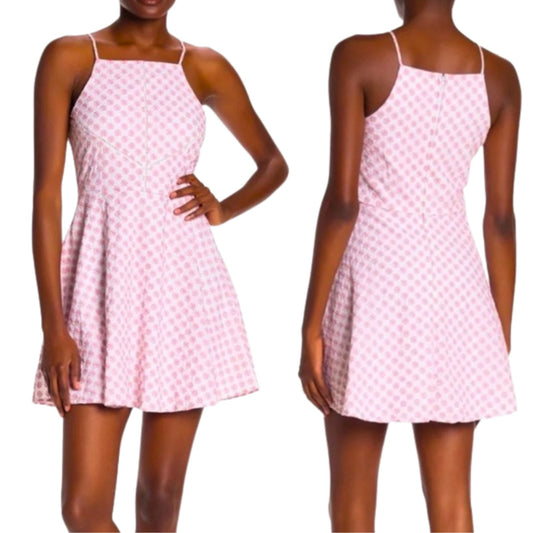 Pink checkered dress worn by a model on a white background