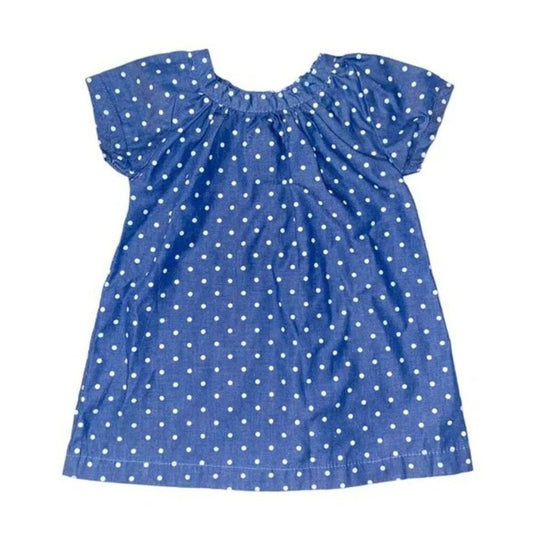 Blue dress with white polka dots on a white background