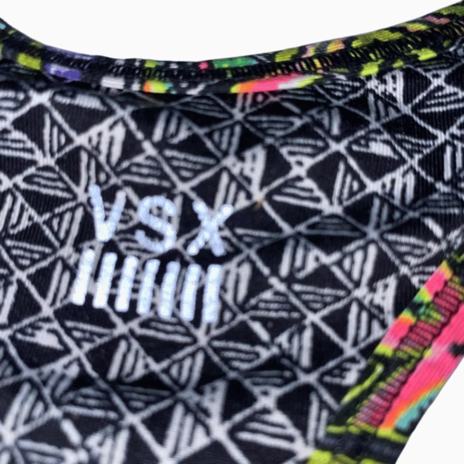 Close-up of a swimsuit with geometric pattern and VS Puma logo