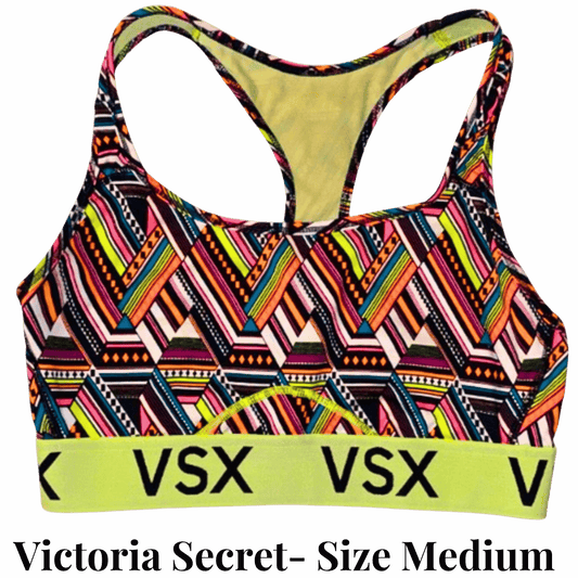 Colorful patterned sports bra with 'VSX' branding on a gray background