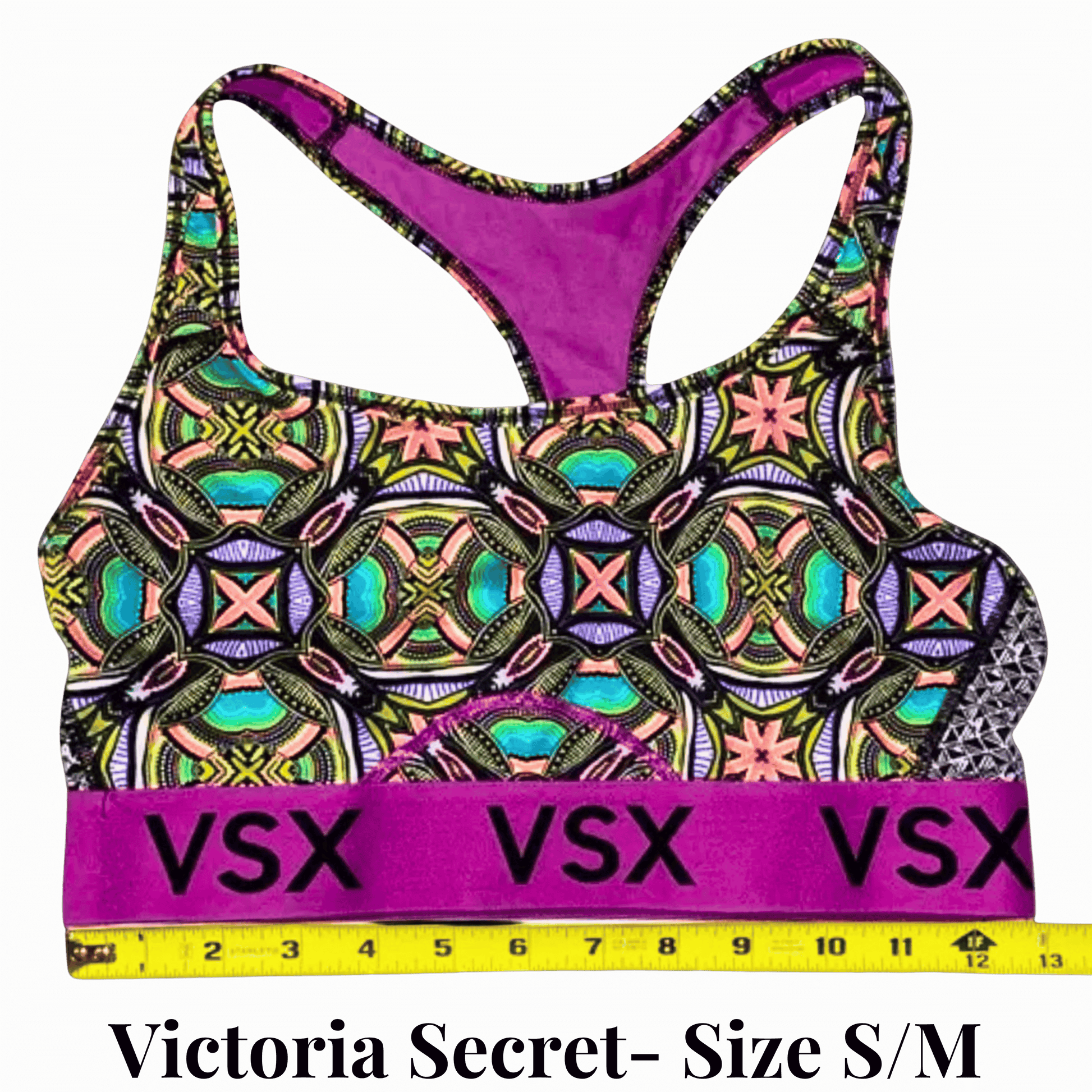 Victoria's Secret sports bra with colorful pattern and purple accents on a light green background