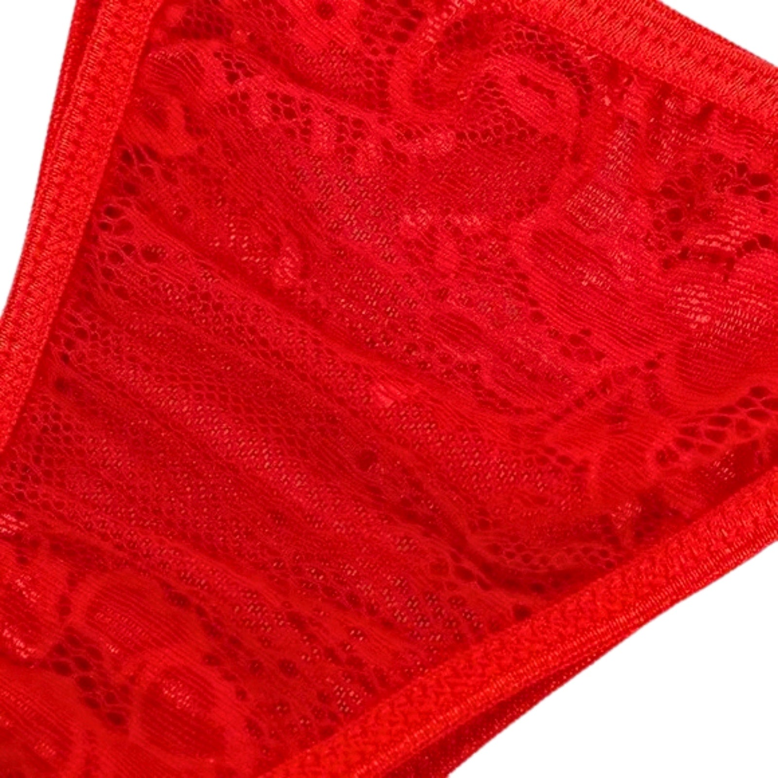 Close-up of red lace fabric on a white background