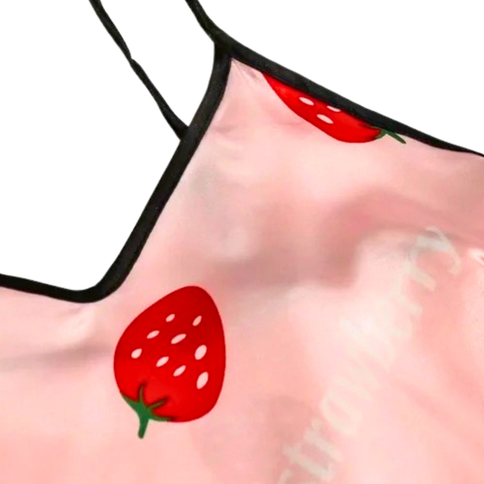 Pink swimsuit with red strawberry design on a white background