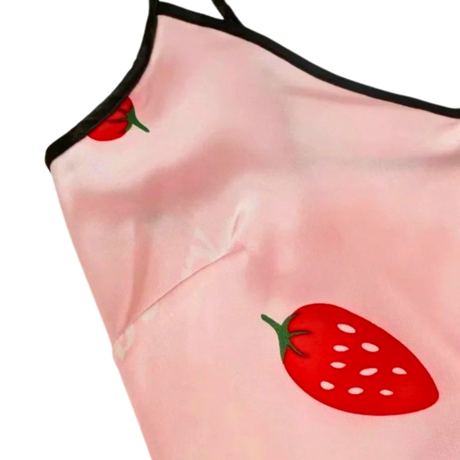 Pink tank top with red strawberry designs on a white background
