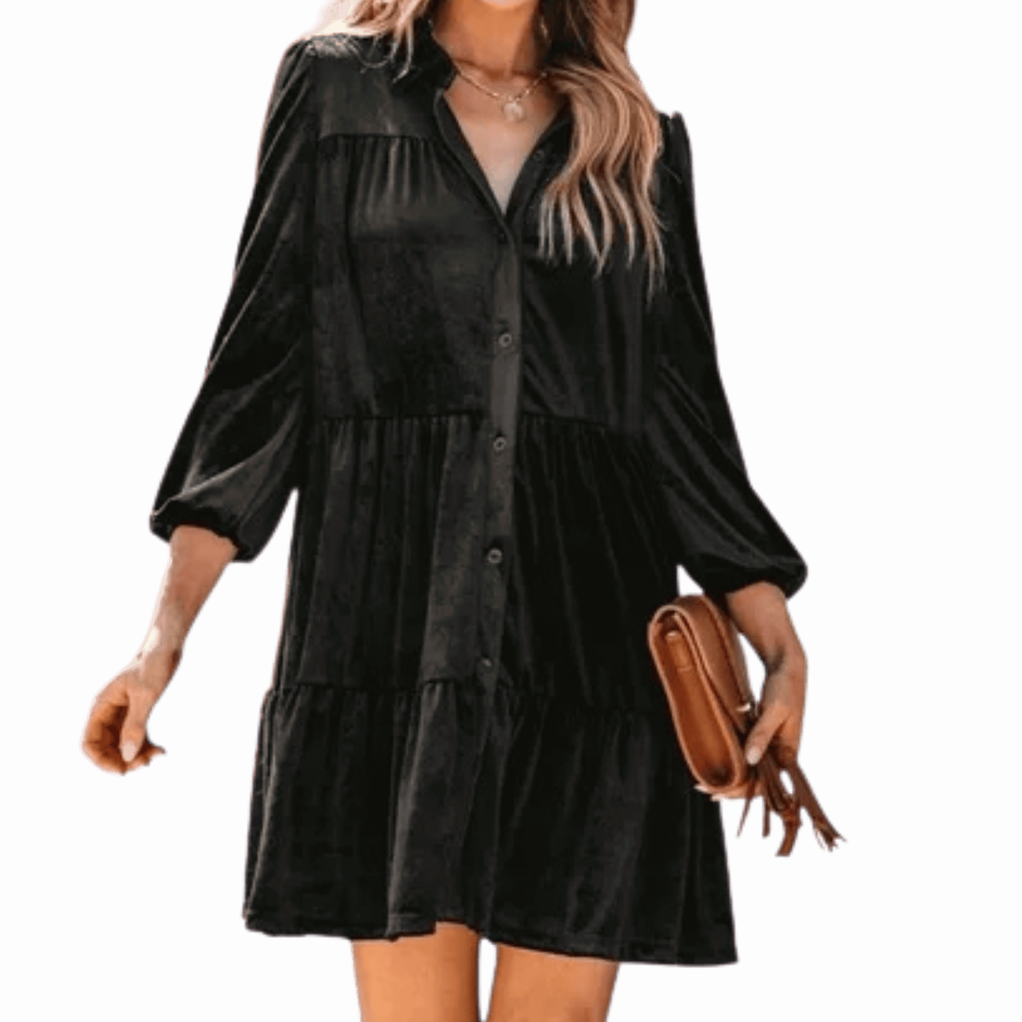 Woman wearing a black dress holding a brown clutch against a black background