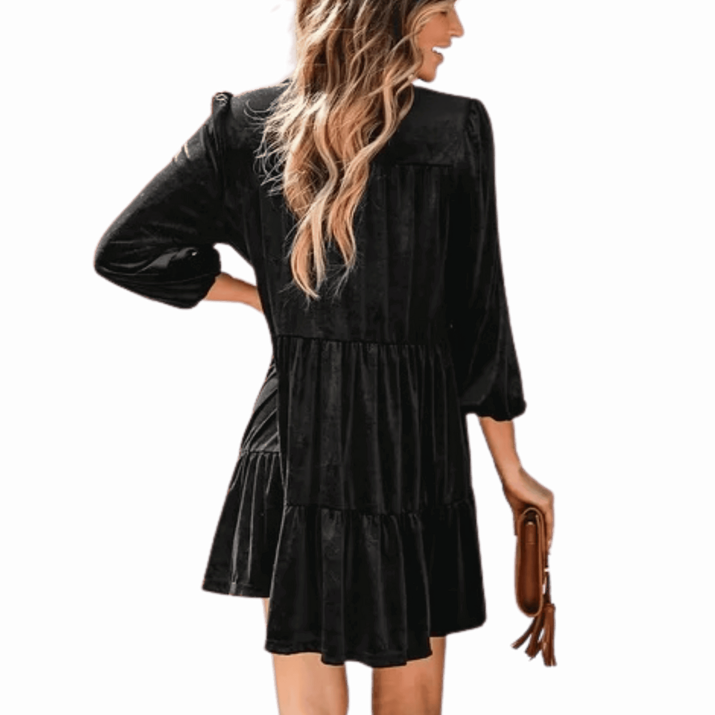 Woman wearing a black dress with a plain background