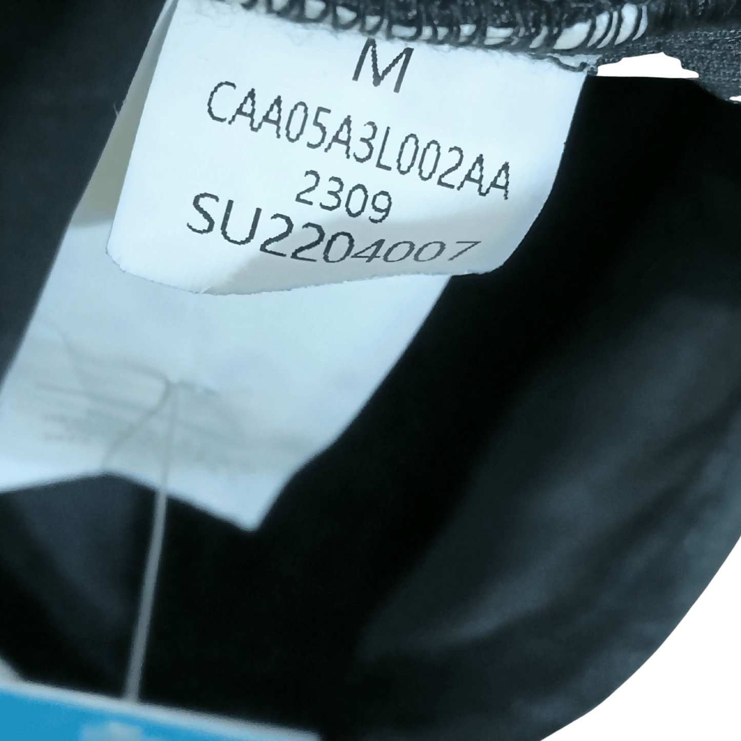 Close-up of a label with text on a garment