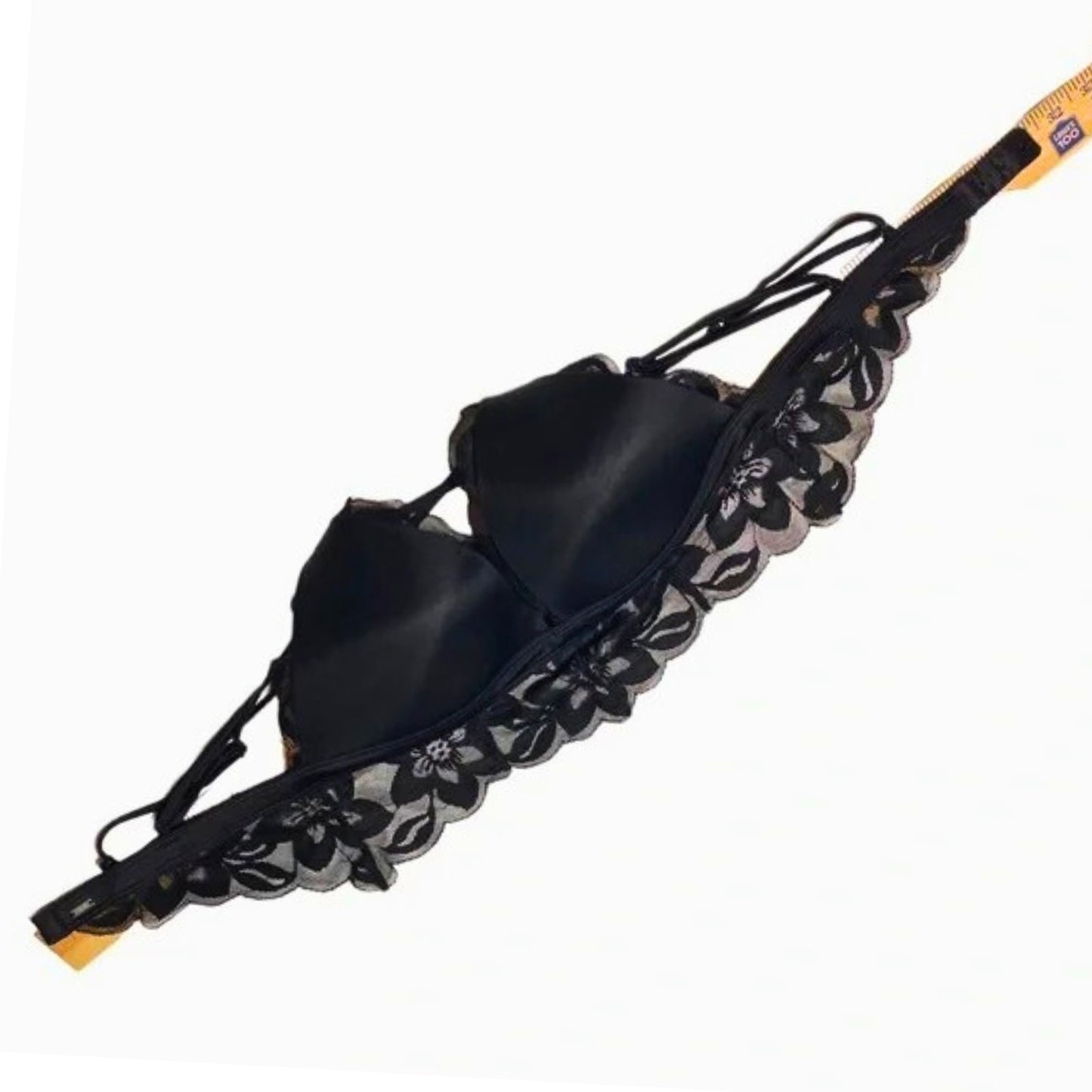 Black sandal with floral lace trim on a white background