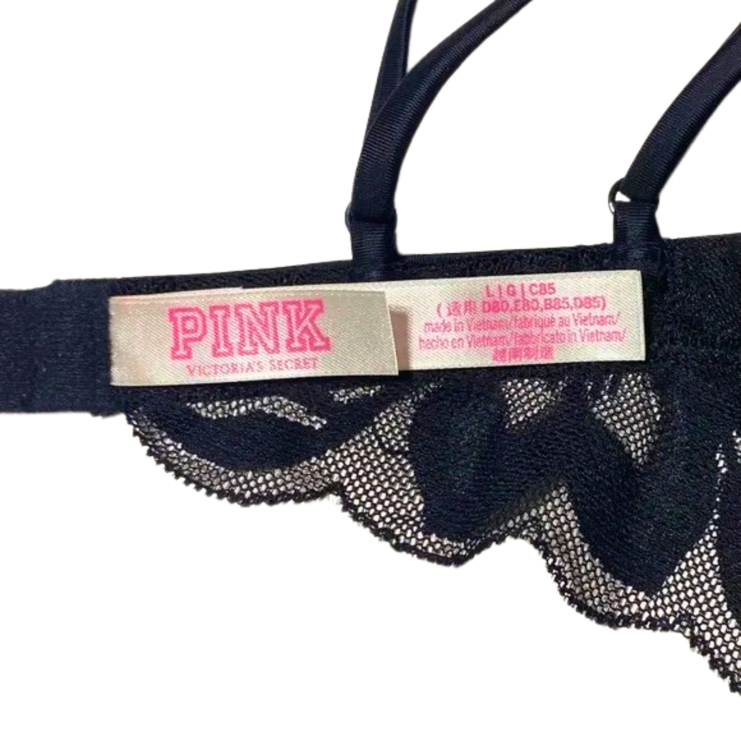 Black lace lingerie with 'PINK' label from Victoria's Secret on a white background