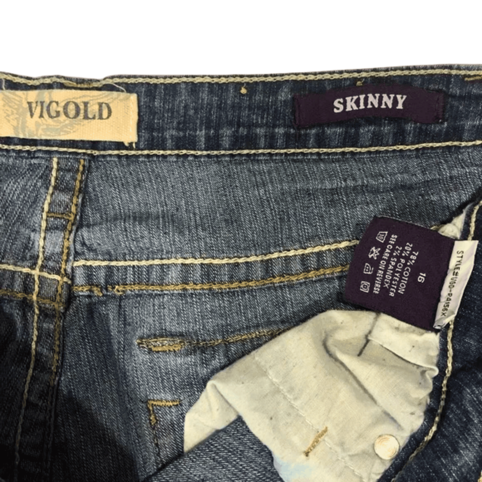Close-up of blue jeans with 'Vigold' brand label and 'Skinny' size tag.