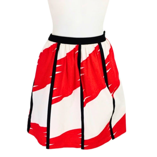 Red and white skirt with black straps on a mannequin against a white background