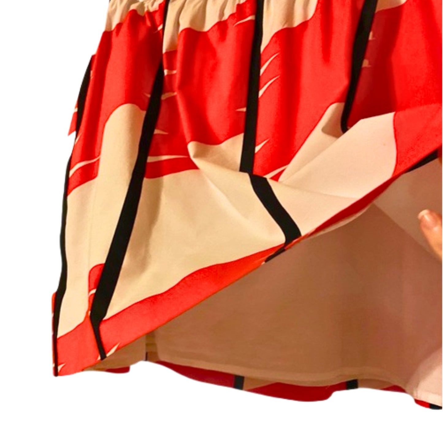 Close-up of a red, beige, and black patterned fabric