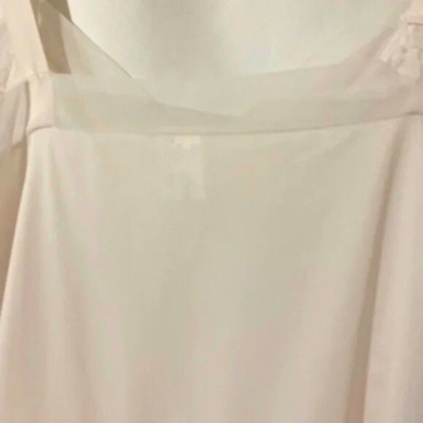 Close-up of a light-colored fabric with a subtle pattern