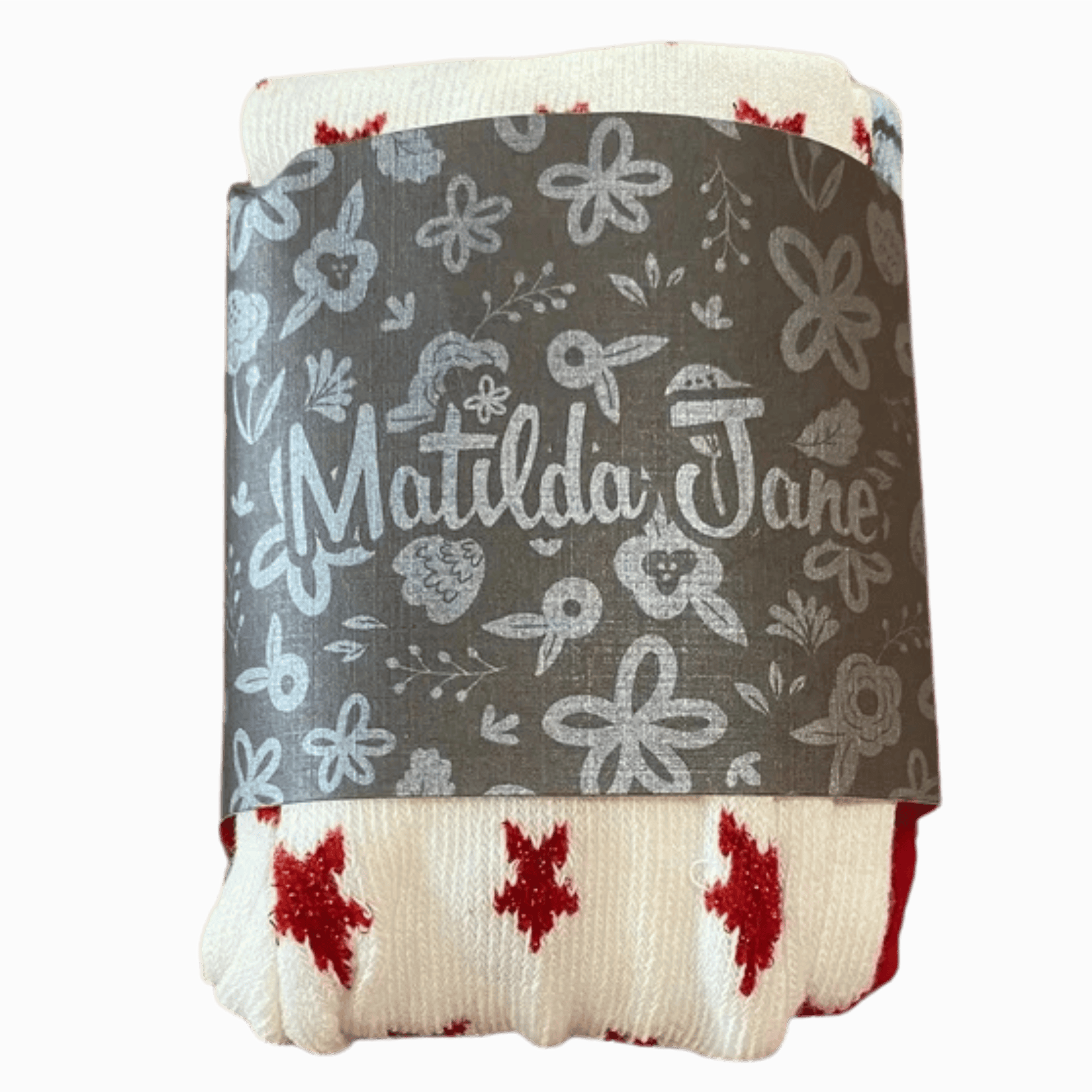 Folded blanket with floral pattern and 'Matilda Jane' branding on a dark background