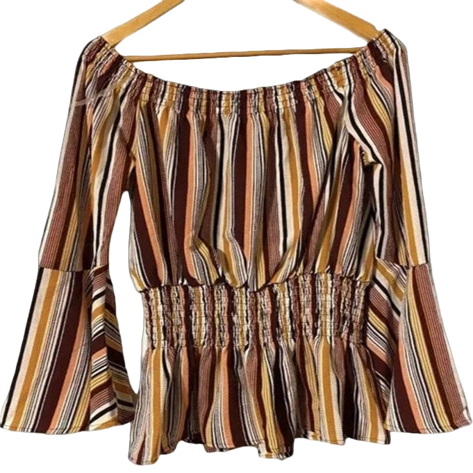 Striped blouse on a hanger with a white background