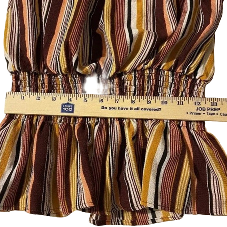Striped fabric with a ruler showing measurements on a white background