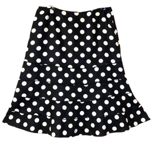 Black skirt with white polka dots on a white background