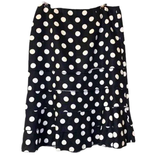 Black skirt with white polka dots on a white background