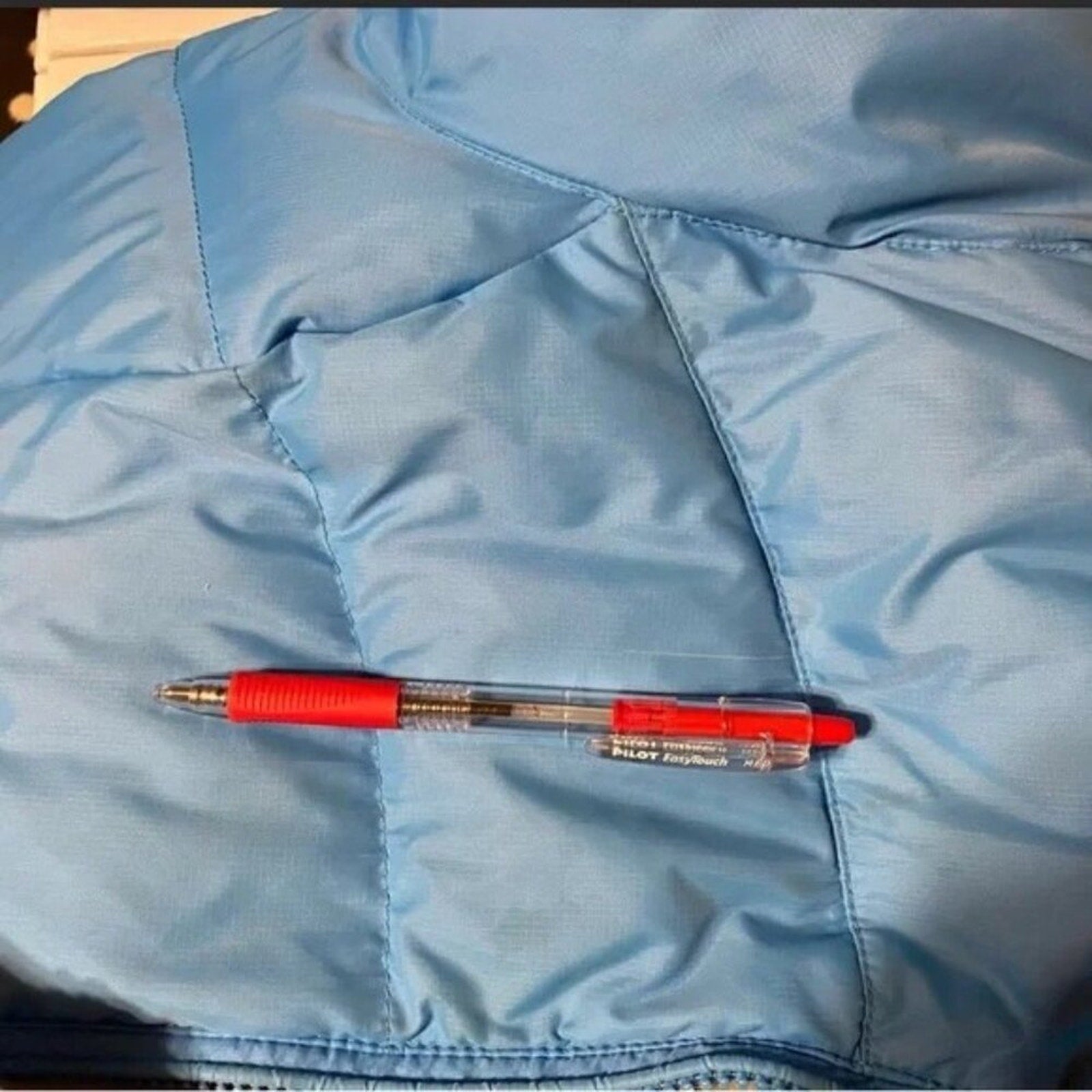 Red pen on a blue jacket