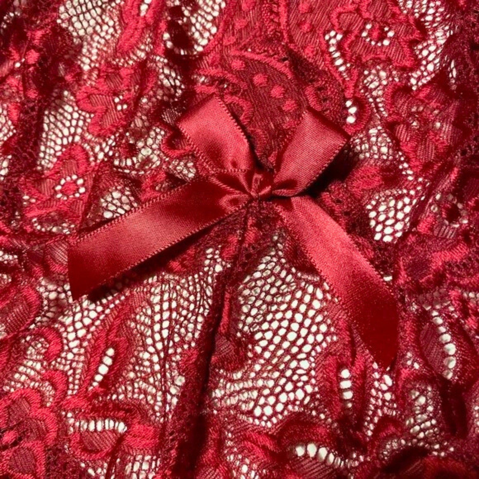 Red lace fabric with a bow