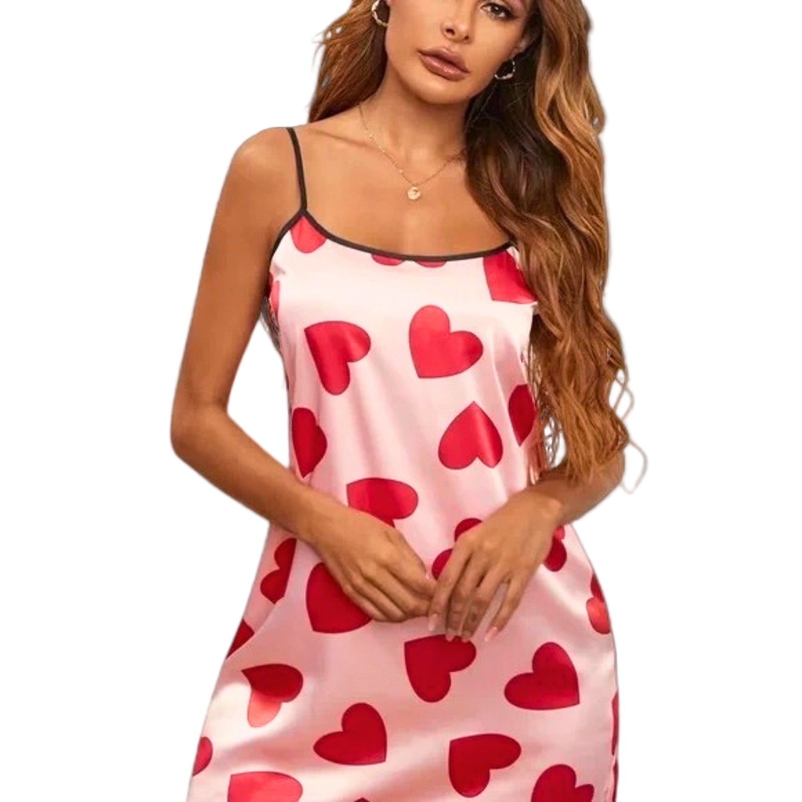 Woman wearing a pink slip dress with red heart patterns on a white background