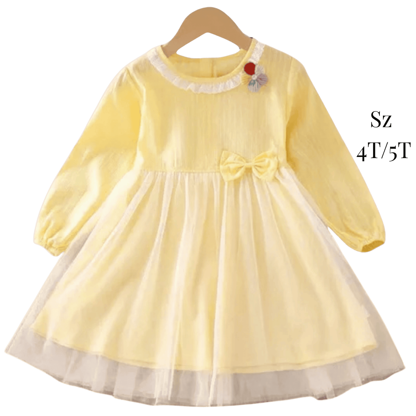 Yellow dress with a bow on a hanger against a green background