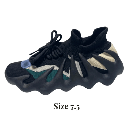 Pair of black shoes with colorful accents on a transparent background