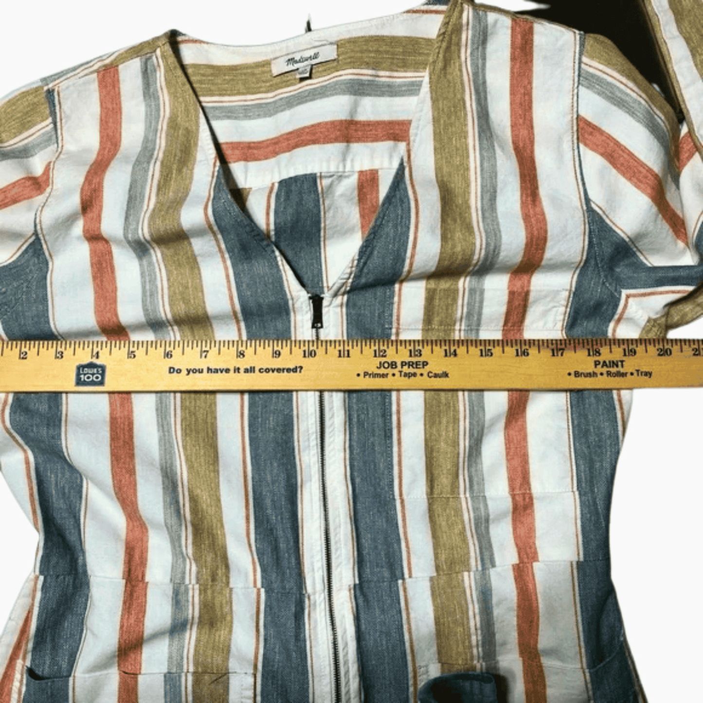 Striped shirt with a ruler for size reference