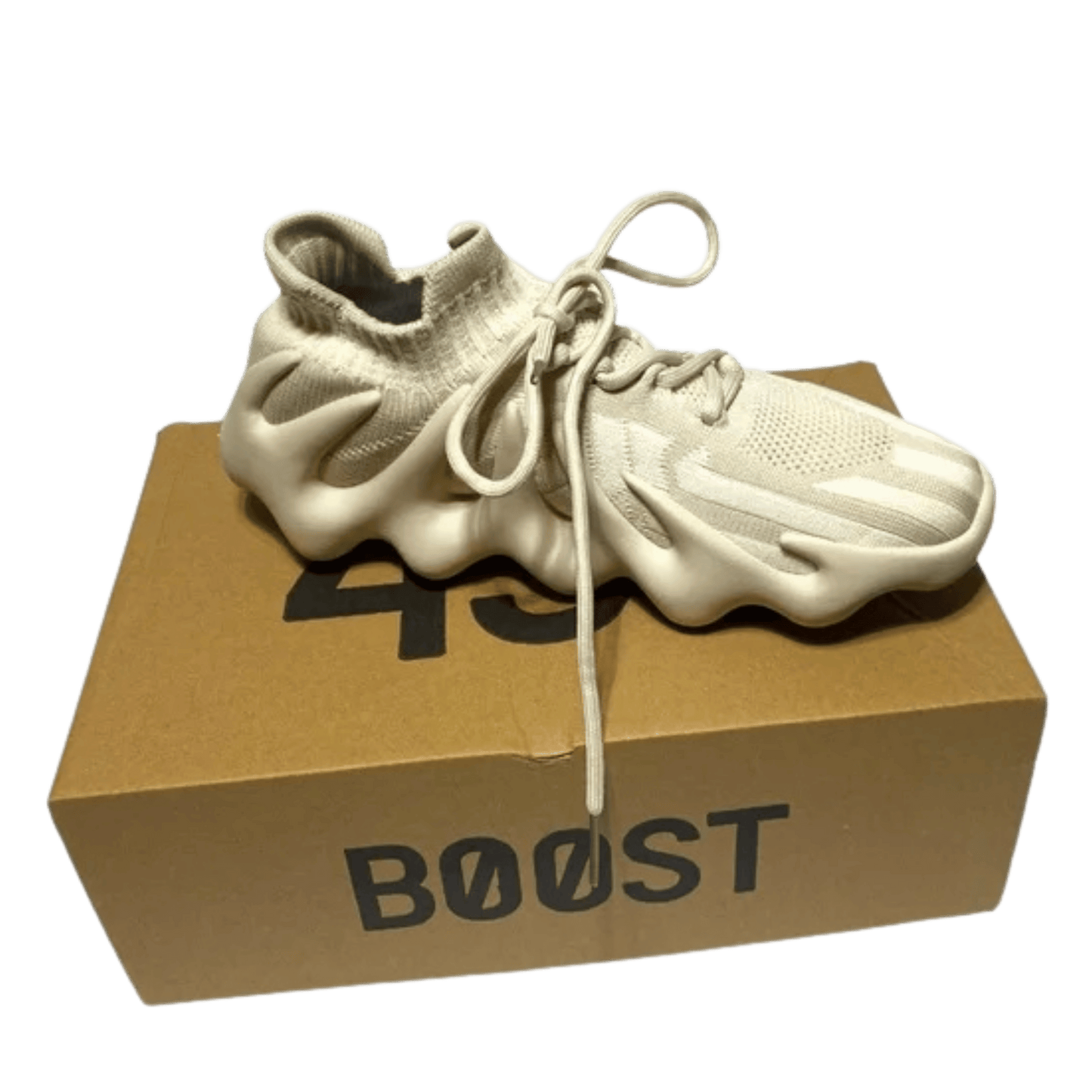 White sneaker on a cardboard box with 'BOOST' branding