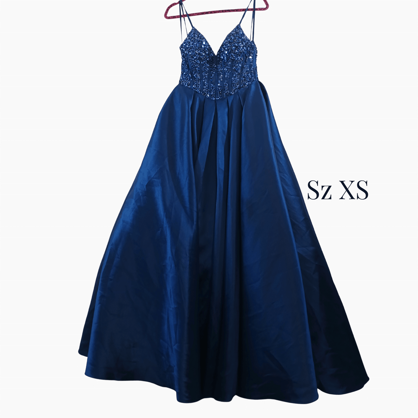Blue evening gown with sequined top on a hanger against a dark background