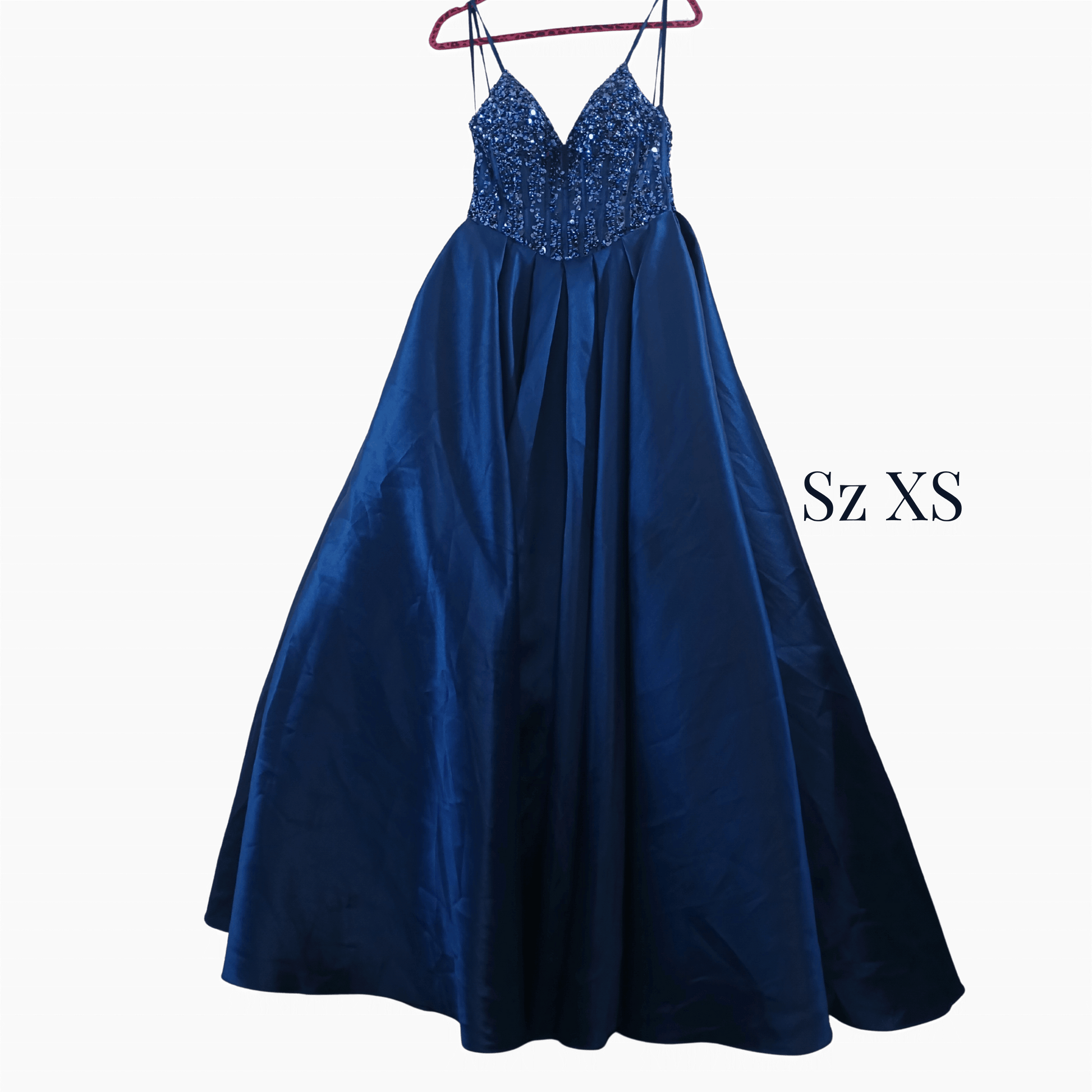 Blue evening gown with sequined top on a hanger against a dark background