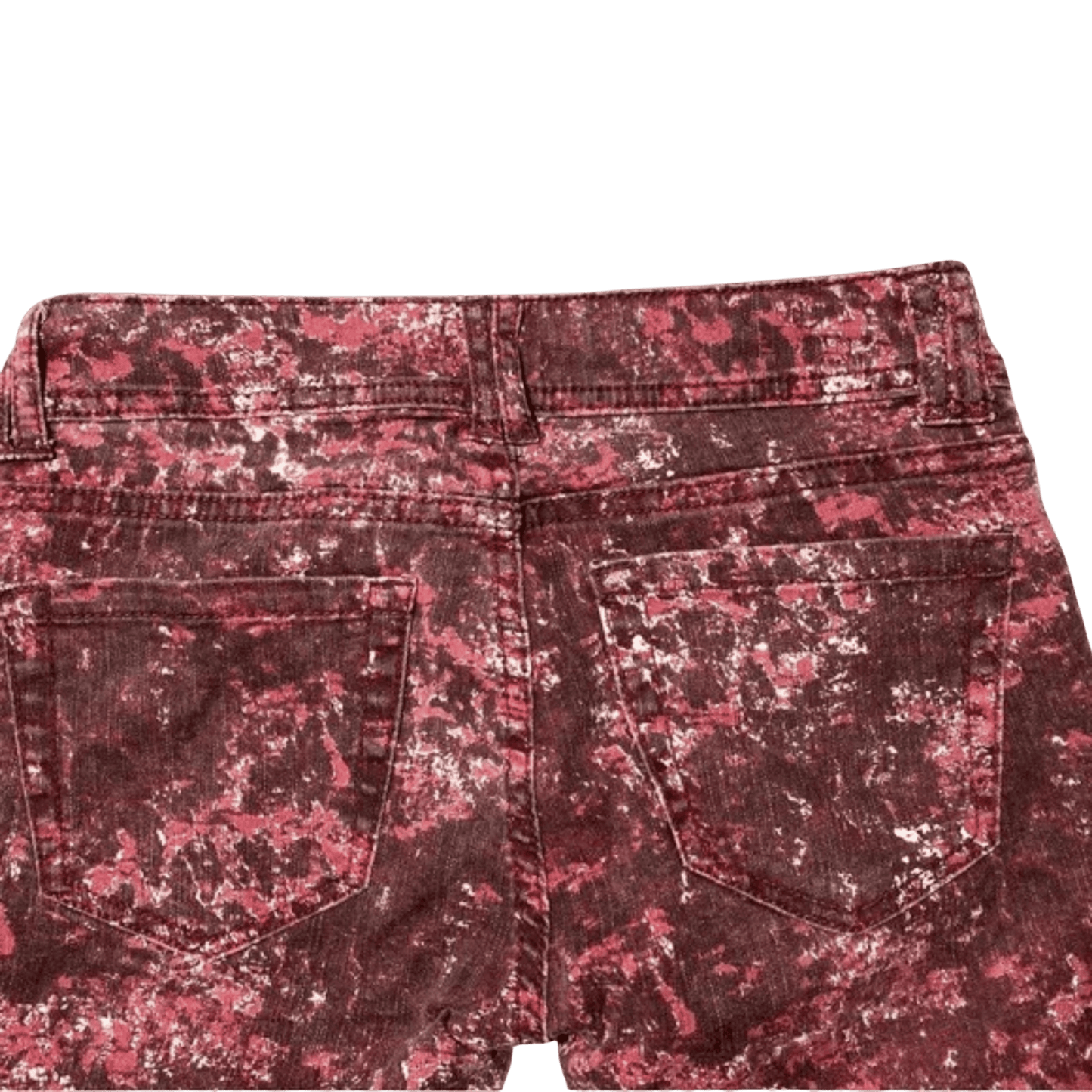 Red floral patterned shorts on a green background