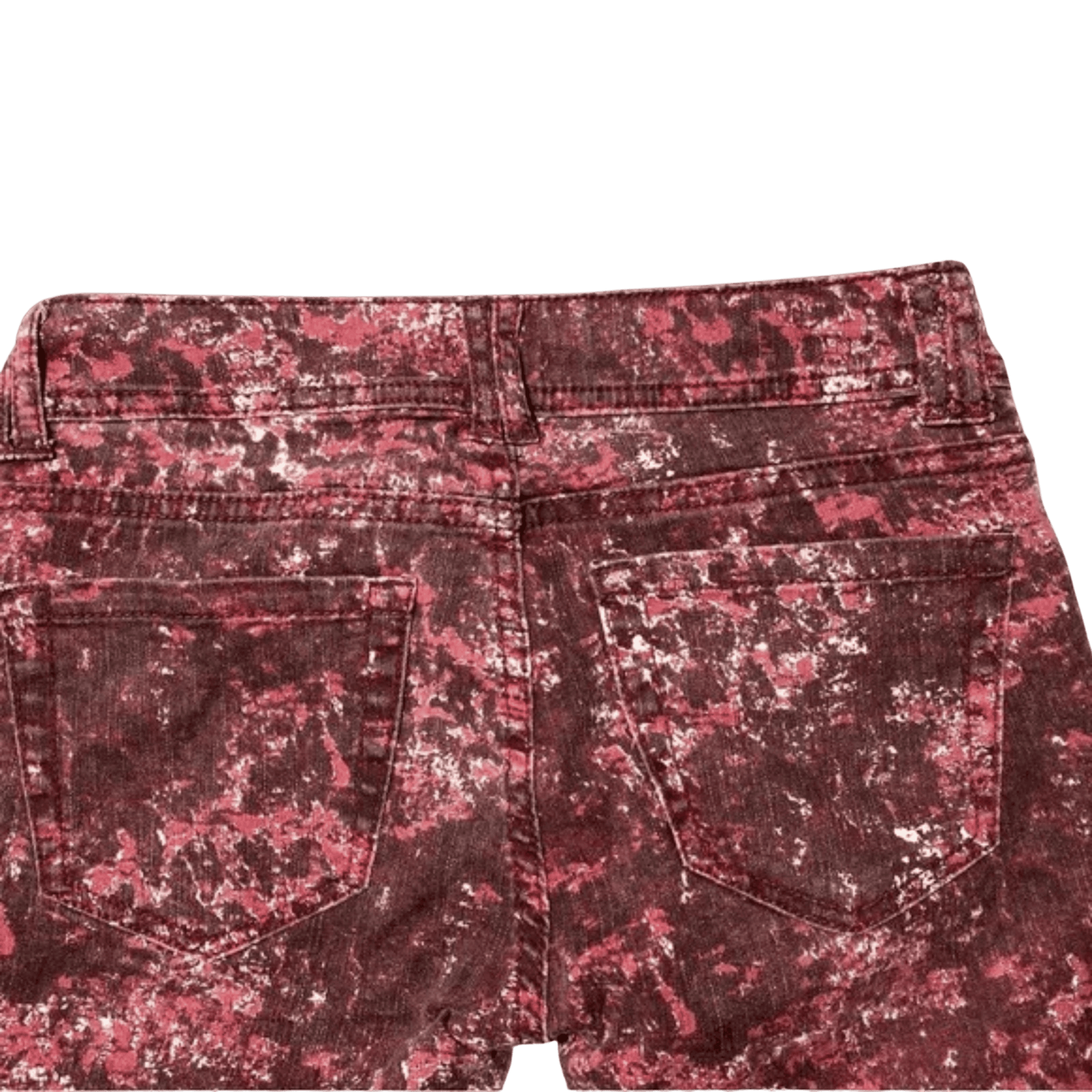 Red floral patterned shorts on a green background