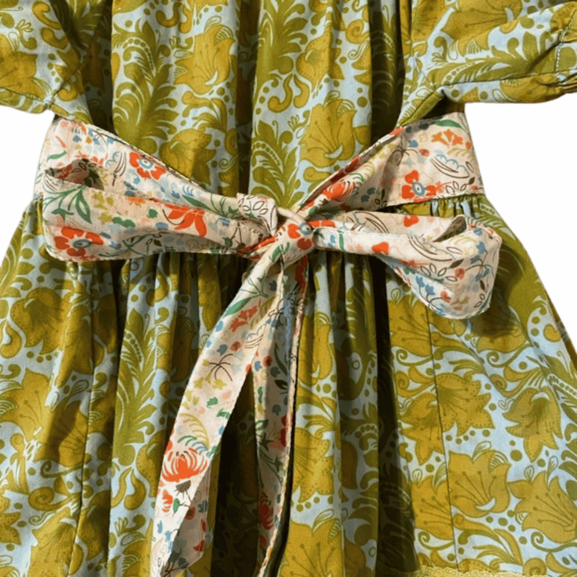 Floral-patterned robe with a colorful belt against a blue background