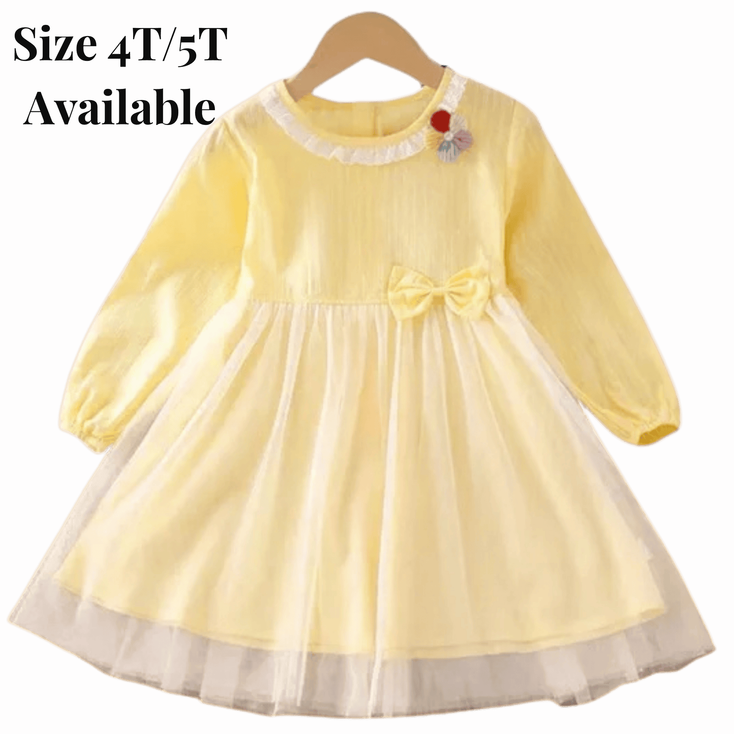 Yellow dress with a bow on a hanger against a red background