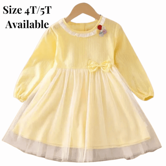 Yellow dress with a bow on a hanger against a red background